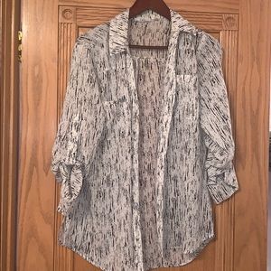 White and black button down blouse.